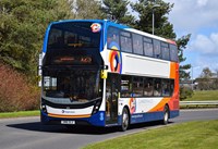 White, orange and blue bus
