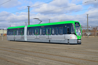 Green and grey tram