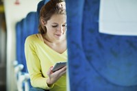 Woman with ipad on plane