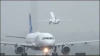 Airplanes in grey sky