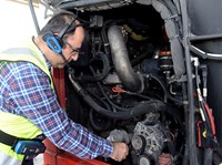 Mechanic fixing bus