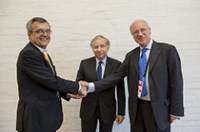 Three men shaking hands