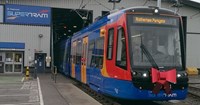 Red, blue and yellow tram