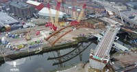 Aerial shot of curved railway bridge installtion