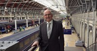 Man in suit standing in train station