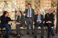 Five men sitting in future bus shelter