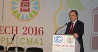 Man speaking at podium of COP22 climate talks