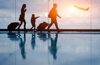 Family walking through airport