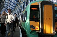 Green and yellow train at platform