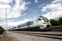 Sliver train with cloudy blue sky