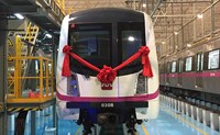 White tram with red bow in the front
