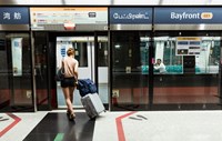 Woman getting on train