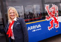 Woman standing in front of Arriva bus