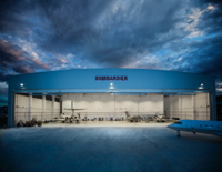 Bombardier hangar with cloudy, stormy background