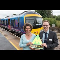 Man and woman in front of train