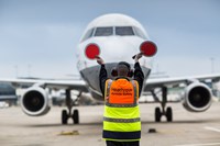 Heathrow air safety personnel directing plane