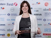 Woman holding glass award