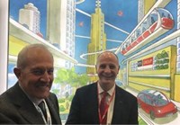 Two men in front of cartoon backdrop