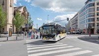 Bus driving through the street