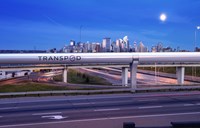 Hyperloop in city at sunset