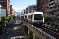 Blue train in green city