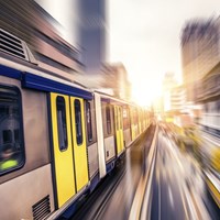 Fast train with yellow and blue doors
