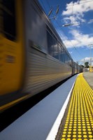 Side of yellow train at platform