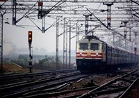 Train moving past signals